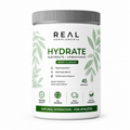 A white plastic tub of Real Supplements Hydrate electrolyte and carbohydrate powder in berry flavour, with a ribbed gray lid and green and black text on the label.